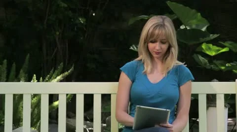 Woman Working on Tablet while Outside Stock Footage 11237725