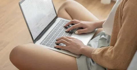 Woman working by using a laptop computer Hands typing on keyboard. writing... Stock-Fotos