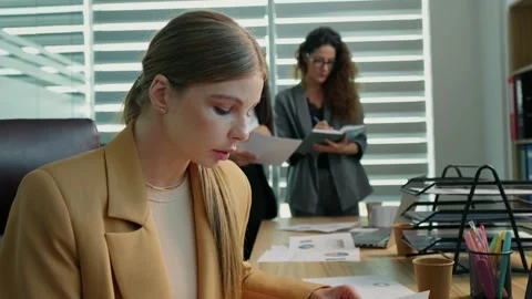 Woman working using laptop looking through analytic data. Stock Footage 299630907