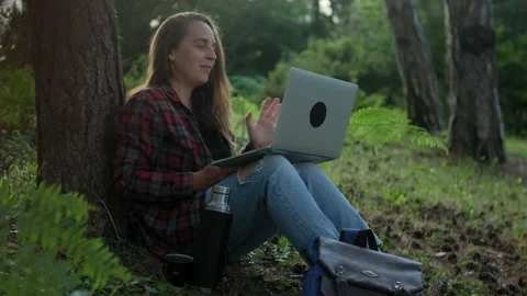 Woman working using laptop making video call with friends Stock Footage 148319314