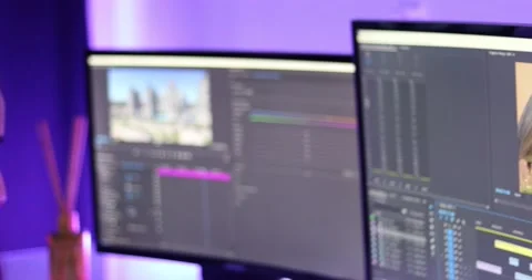 Woman working on a video editor software with two screens Stock-Footage 159104727