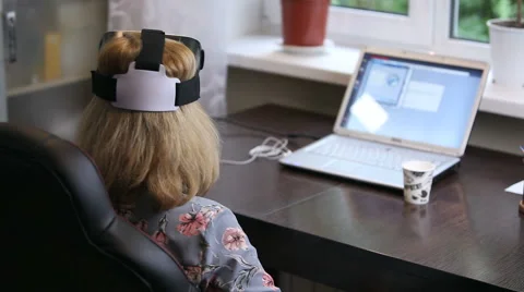 A woman working in a virtual reality 3D headset Stock Footage 65288997