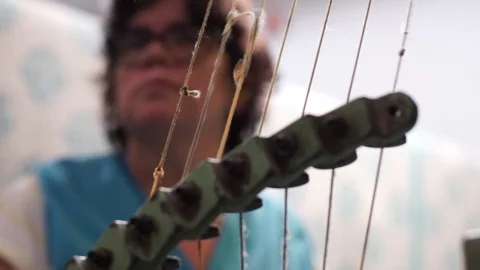 Woman working on a weaving machine. Stock Footage 72590868