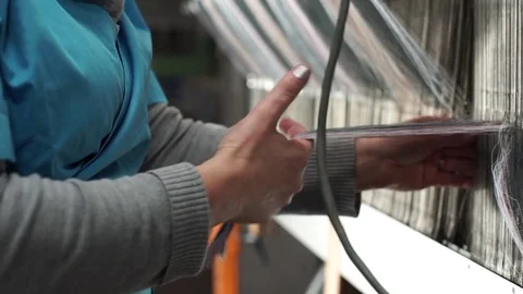 Woman working on a weaving machine. Video stock 72595032