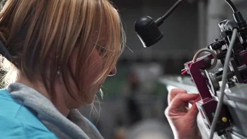 Woman working on a weaving machine. Video stock 72595085