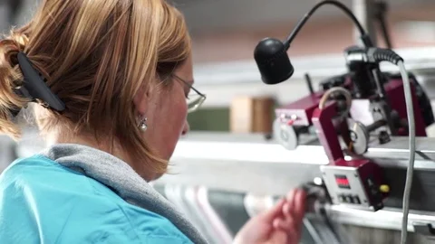 Woman working on a weaving machine. Stock Footage 72595625
