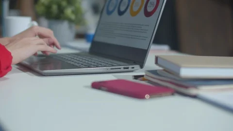 Woman works with a computer and with documents Stock Footage 129966899
