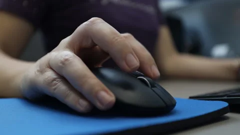 Woman works on the computer using the mouse. Close up hand. Stock Footage 155622401