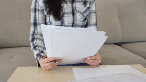 Woman works with documents on the table. Stock Footage 115348820