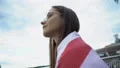 Woman wrapped in American flag outdoors, proud of country, Independence Day 4k or 4k+ Resolution
