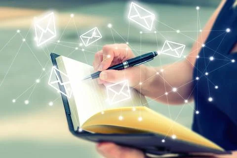 Woman write down letters in notebook for send message without computer. Bu... Stock Photos