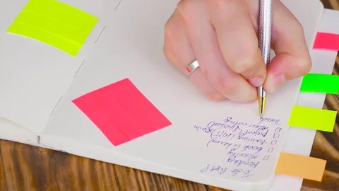 Woman write notes in notepad . Stock Footage 77728232