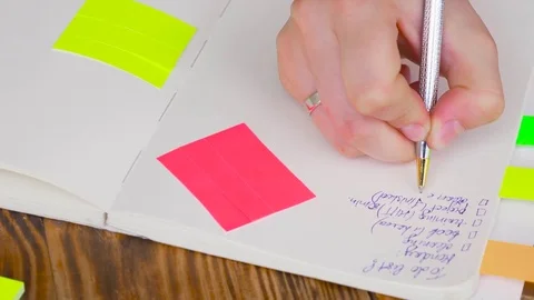 Woman write notes in notepad . Stock Footage 77728234