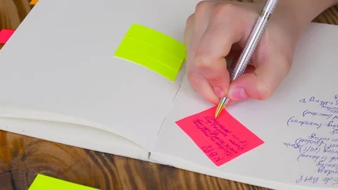 Woman write notes in notepad . Stock Footage 77728241