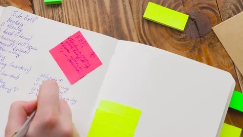 Woman write notes in notepad . Stock Footage 77728244