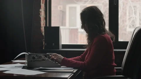 Woman Writer Using Typing Machine to Create Novel Stock Footage 171122151