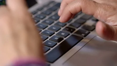 Woman writes on her computer, close Stock Footage 76561658