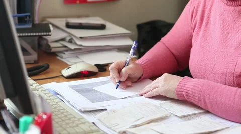 Woman writes a note working in the office Stock Footage 58866988