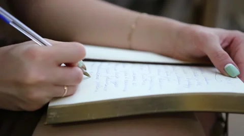 The woman writes in a notebook Stock Footage 55876375