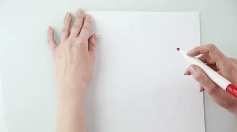 Woman writes on a sheet of paper plan Stock Footage 62638767
