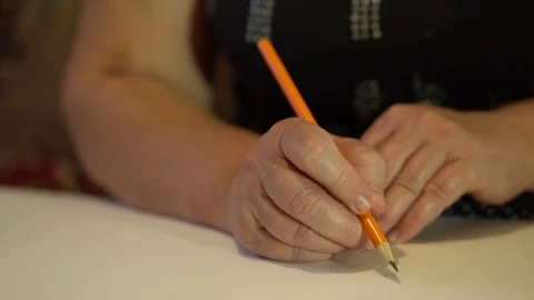 Woman writes in simple pencil. delayed removal. hands closeup Video stock 80050108
