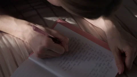 Woman writing in diary. Stock Footage 170239345