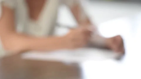 Woman writing a letter Stock Footage