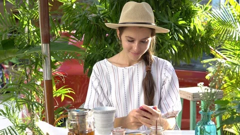 Woman writing message on smartphone while drinking tea. Stock Footage 88668769