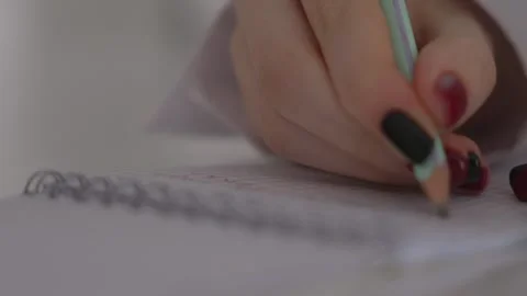 Woman Writing Notes in Notebook with Pencil, Close Up Study Scene Stock Footage 329889576