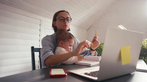 Woman writing notes talking on cellphone remote work from home office during Vídeos de archivo 164487223