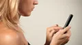 Woman writing on smartphone (close up) HD Footage