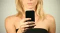 Woman writing on smartphone HD Footage