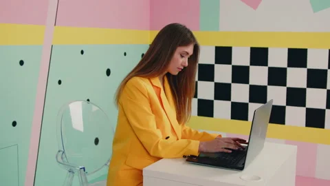Woman In Yellow Jacket Works On Laptop Stock Footage 166345451