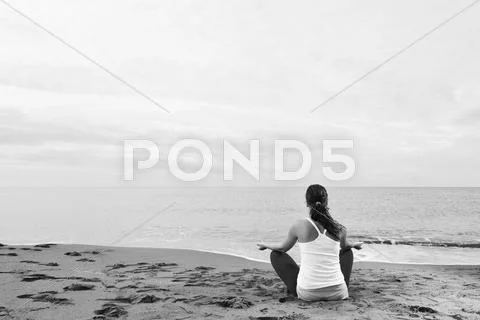 Woman yoga beach Stock Photos