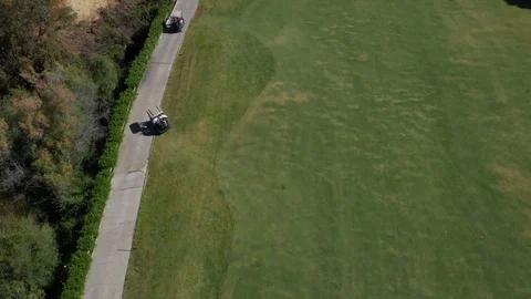 Woman_buggy_Golf_footagedrone Video stock 108485053
