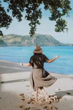 Woman,Dancing,At,The,Beach.,Having,Fun. Stock Photos