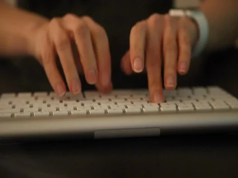 Woman's ahnds typing white keyboard Stock Footage 73363272