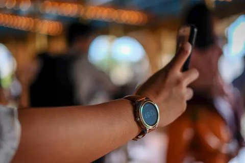 Woman's arm wearing a watch Stock Photos