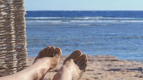 Woman's bare feet on a beach. Stock Footage 83212412