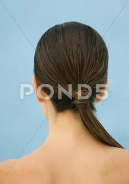 Woman's Bare Upper Back And Head With Ponytail