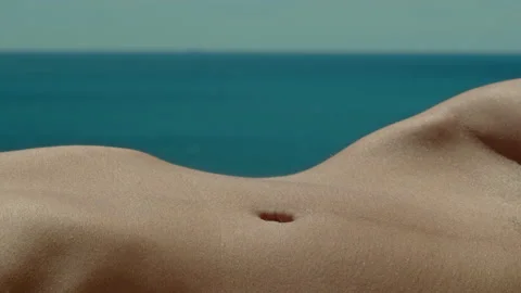 Woman's belly in the sun Stock Footage 161472948