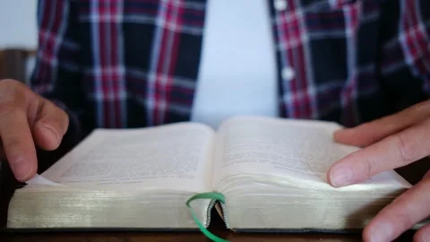 A woman's Bible reading and prayer epitomize faith in God and Jesus Christ Stock Footage 252839176