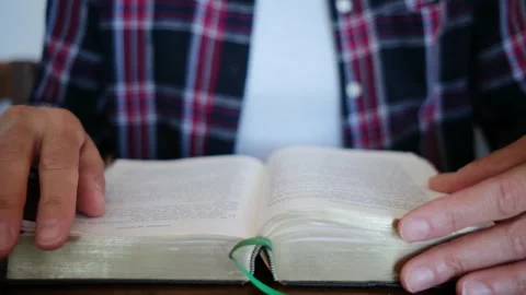 A woman's Bible reading and prayer epitomize faith in God and Jesus Christ Stock Footage 252839187