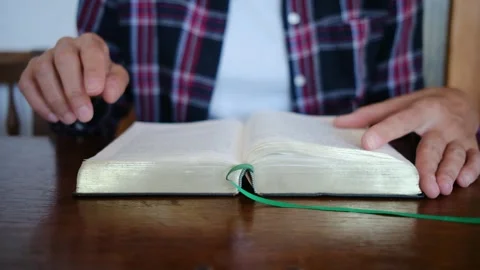 A woman's Bible reading and prayer epitomize faith in God and Jesus Christ Stock Footage 252839220