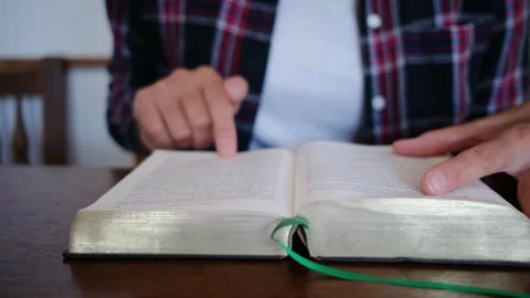 A woman's Bible reading and prayer epitomize faith in God and Jesus Christ Stock Footage 252839221