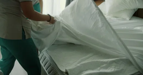 Womans changing the bedding in the room.Employees, two maids of the hotel Stock Footage 219955395