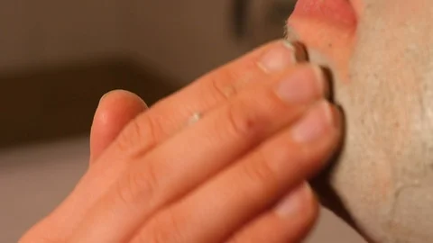 Woman's chin while performing rejuvenation treatment Stock Footage 101239115