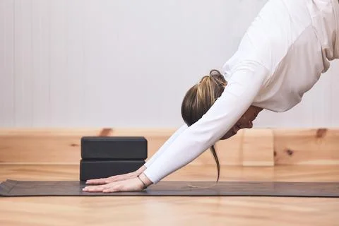 Woman's doing a difficult plane stretching on a yoga mat with copy space Stock Photos