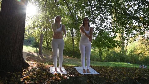 Womans doing yoga Stock Footage 136464625