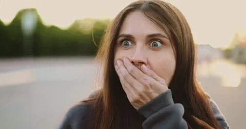 A woman's emotional transformation captured in two frames: from a calm Stock Footage 344807993